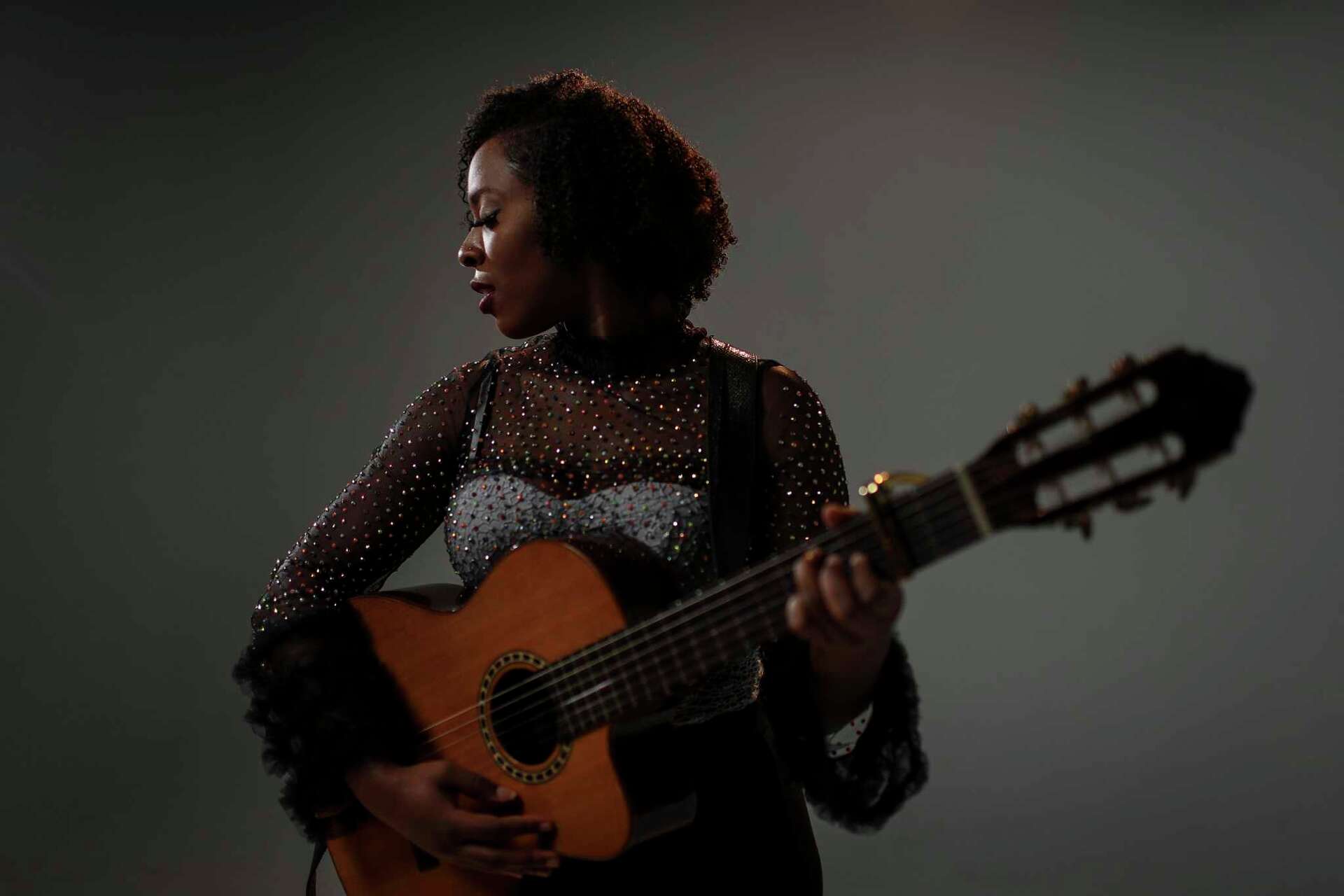Kristal Cherelle performing with guitar
